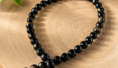 Fil de perles en Obsidienne oeil céleste A